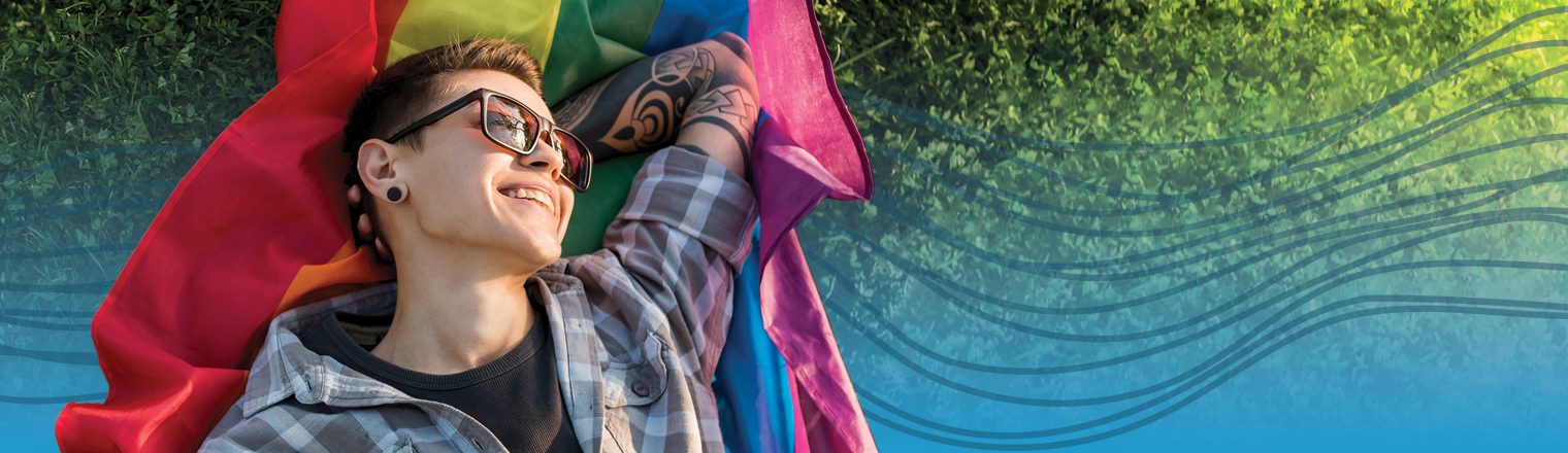 Person at the Pride Festival. Blue gradient and spectrum are applied behind them
