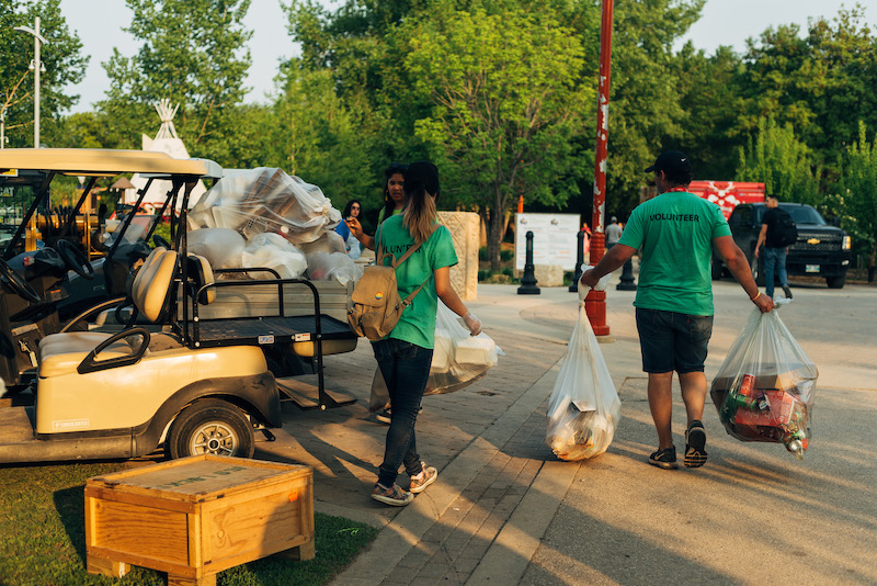 two volunteers working on recycling